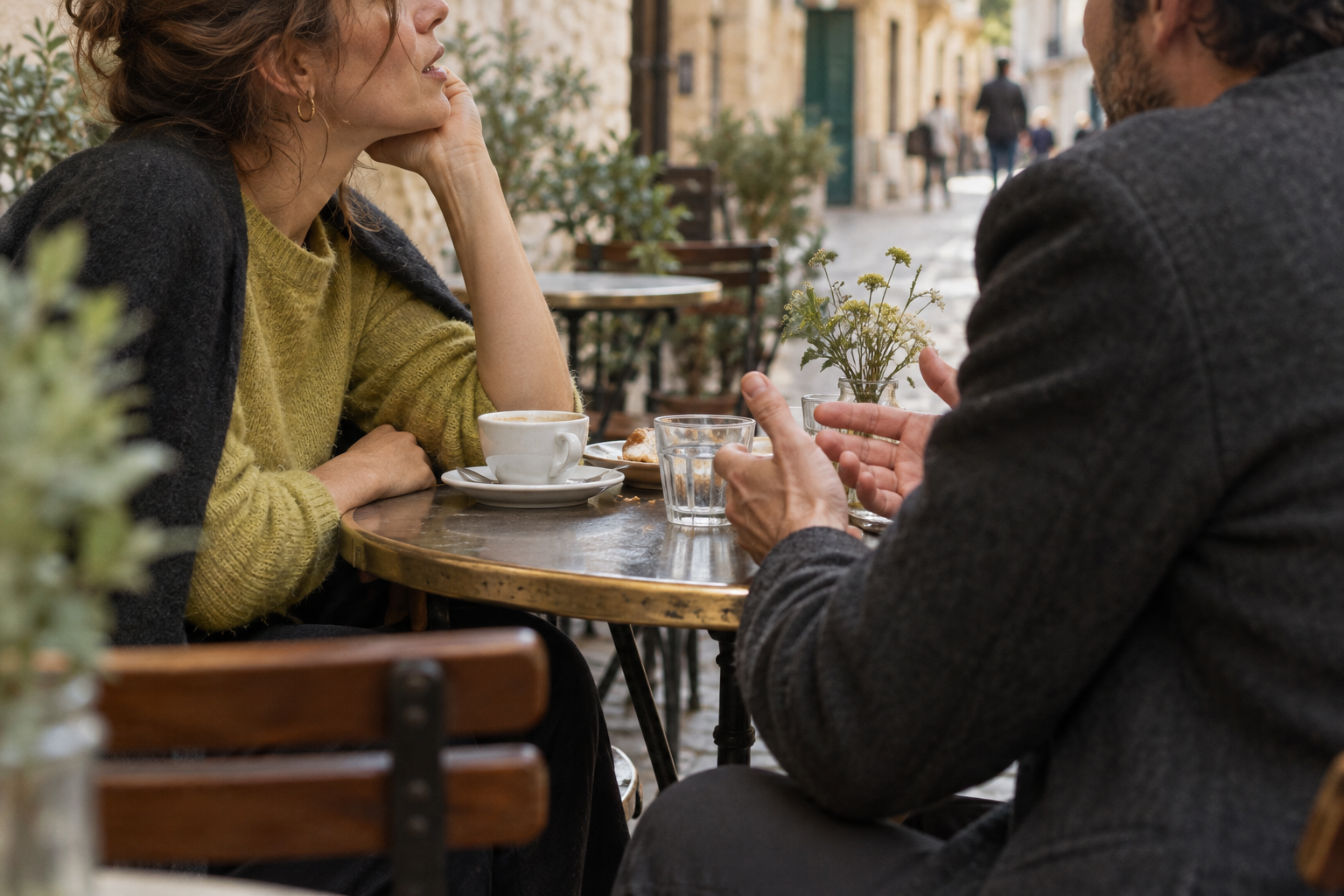 Two people talking at a café
